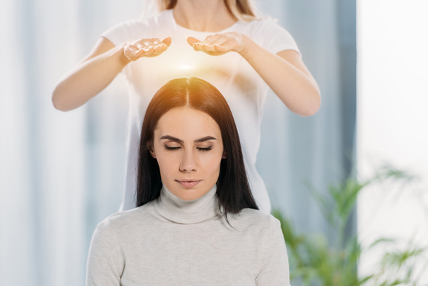 Reiki master with client